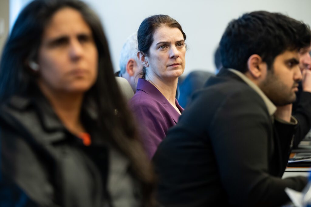 Women watching presentation concentrating seriously.